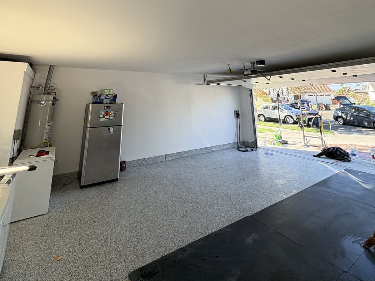Freshly finished garage ceiling and walls with a new epoxy floor